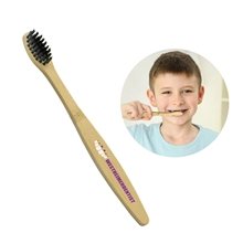 a wood handle with black bristles kids bamboo toothbrush
