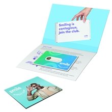 a group of greeting card with credit card style dental floss with mirror