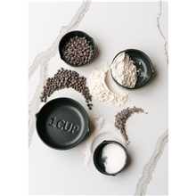 aerial view a group of be home(r) brampton nested stoneware measuring cups, image 1 of 2