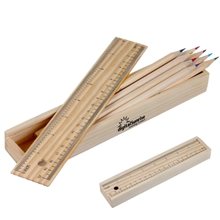 a beige box & assorted pencil colored pencil set w / ruler