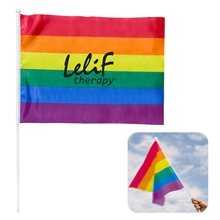 a rainbow flag with white pole rainbow pride flag