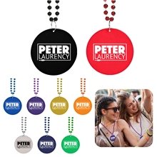 a group of medallion beaded necklaces