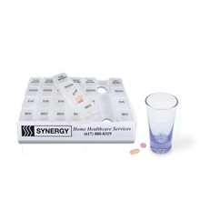 a group of translucent plastic 24/7 medicine tray organizer - pill holder