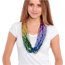 a group of rainbow mardi gras beads necklace