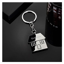 aerial view a group of promotional custom 1 5/8w x 1 3/4h x 1/8t polished chrome the casa key chain, image 1 of 5