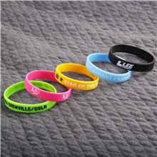 aerial view a group of printed silicone bracelets, image 1 of 2