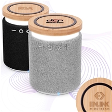a group of lex bamboo wireless speaker with phone charger