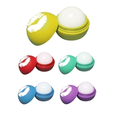 aerial view a group of scented round lip balm with matte finish, image 1 of 2