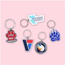 aerial view a group of 1.75 x 1.75 diestruck soft enamel keychain, image 1 of 3