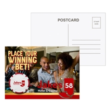 a group of post card with poker chip