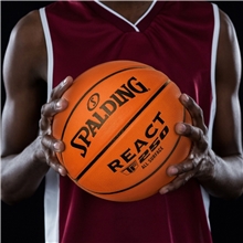 a group of spalding(r) full - size composite leather basketball