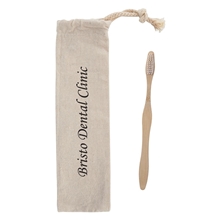 aerial view a natural bamboo toothbrush in cotton pouch, image 1 of 5