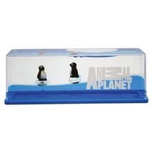 aerial view a clear penguin wave paperweight, image 1 of 5
