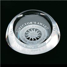 a clear crystal dome paperweight