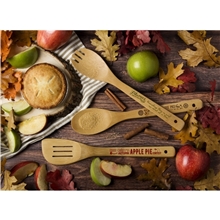 a group of bamboo slotted spatula