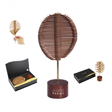 aerial view a brown playableart wood golden angle helicone spinner to transform and relax, image 1 of 2