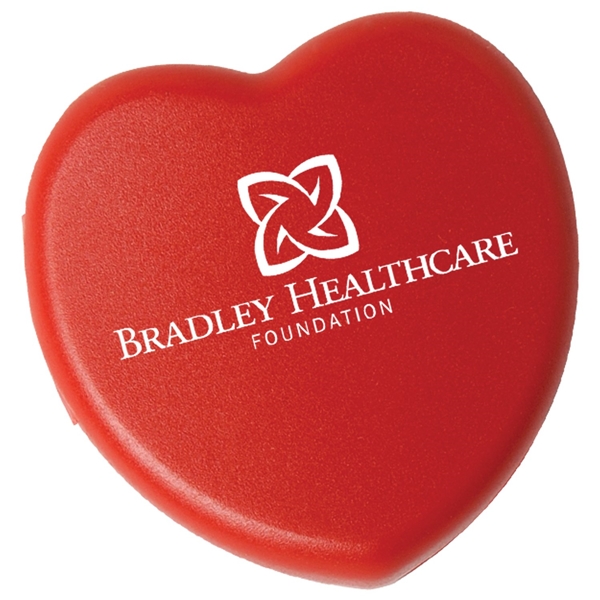 aerial view a red heart shaped pill box, image 2 of 2