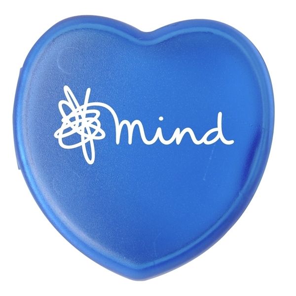 aerial view a translucent blue heart shaped pill box, image 2 of 2