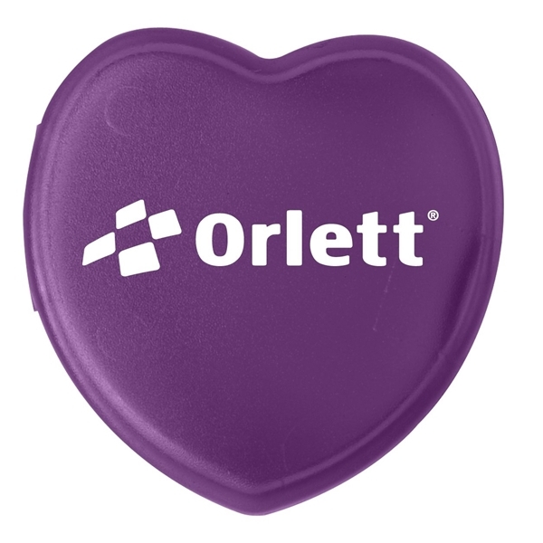 aerial view a translucent purple heart shaped pill box, image 2 of 2
