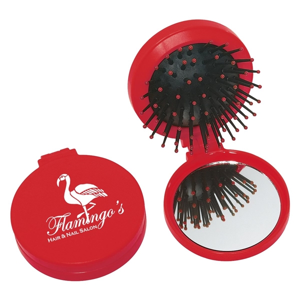 aerial view a red brush and mirror compact 2- in -1 mini travel kit, image 2 of 3
