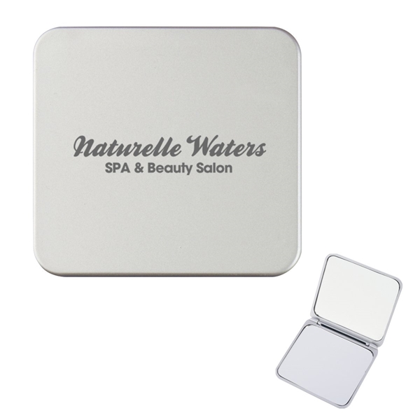 aerial view a solid silver compact mirror with dual magnification, image 2 of 4