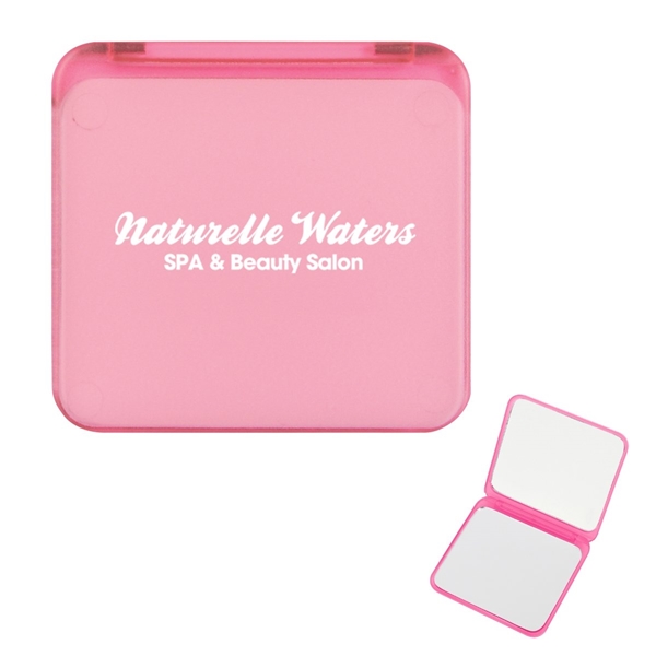 aerial view a translucent pink compact mirror with dual magnification, image 2 of 4