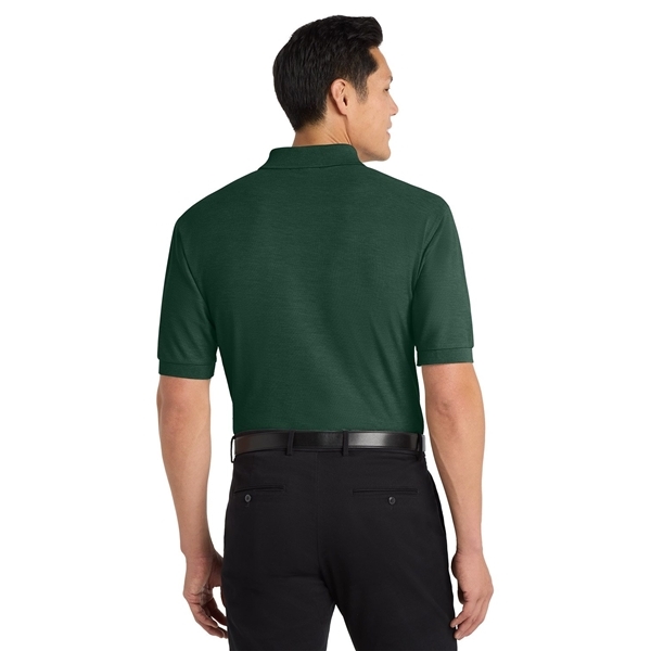 aerial view a dark green port authority silk touch polo shirt, image 4 of 5