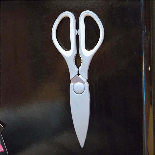aerial view a grey kitchen scissor with sheath, image 4 of 4