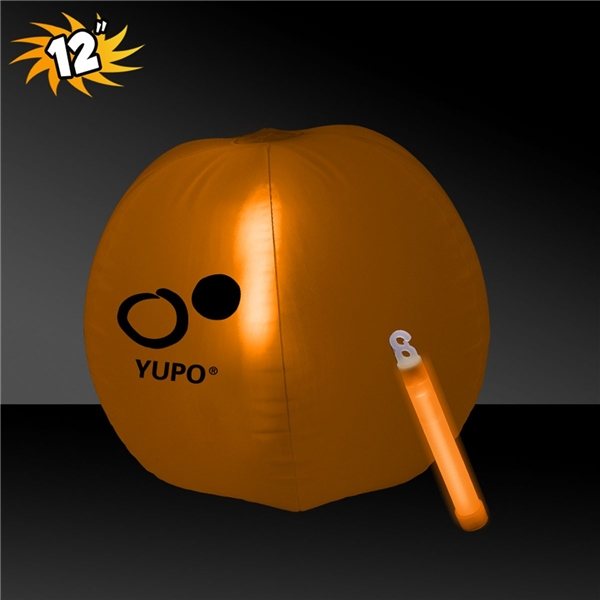 aerial view a orange 12 inch inflatable beach balls with 1 - 6 inch orange glow stick, image 2 of 3