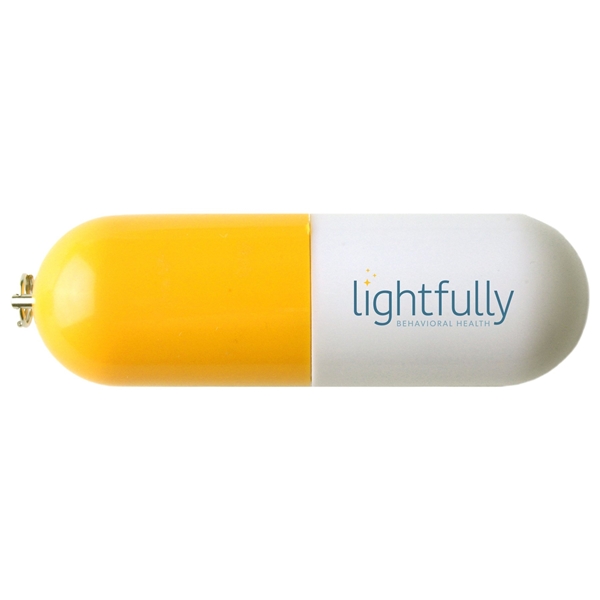 aerial view a yellow vail usb flash drive pill capsule, image 2 of 2
