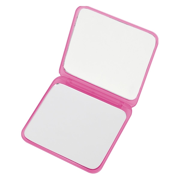 aerial view a translucent pink compact mirror with dual magnification, image 4 of 4